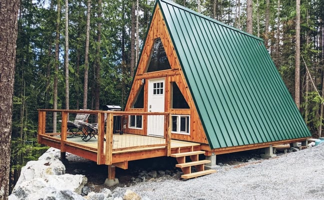 A-frame cabin at Rocky Valley Resort with forest views, designed for romantic getaways and group stays